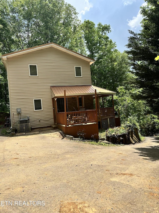 rear view of house with a porch