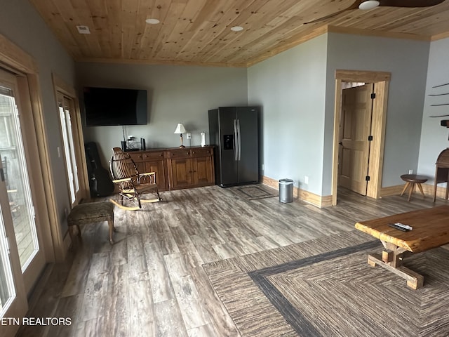 living room featuring light wood-style floors, wood ceiling, baseboards, and a ceiling fan