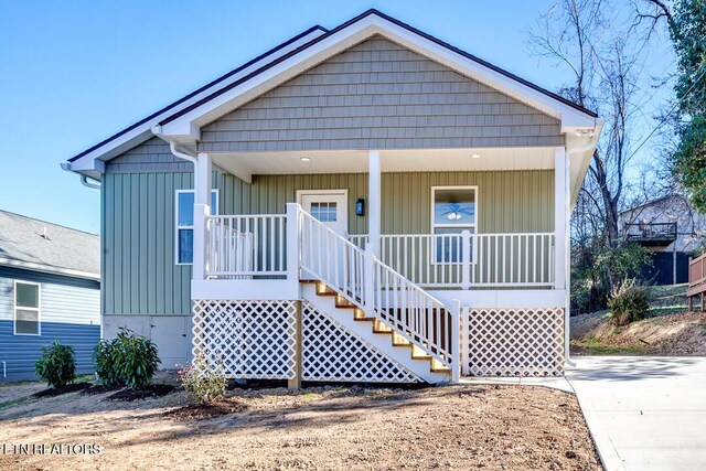 1624 Folsom Ave, Knoxville, TN 37917 - bungalow featuring covered porch, board and batten siding, and stairway