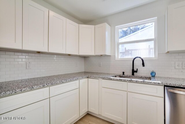 1624 Folsom Ave, Knoxville, TN 37917 - kitchen with a sink, white cabinets, backsplash, and dishwasher