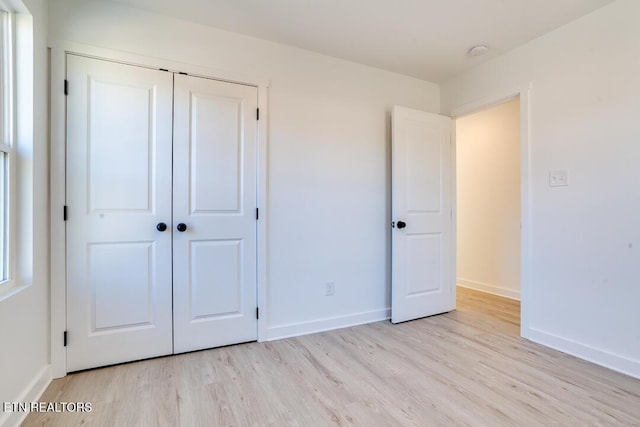 1624 Folsom Ave, Knoxville, TN 37917 - unfurnished bedroom with baseboards, light wood finished floors, and a closet