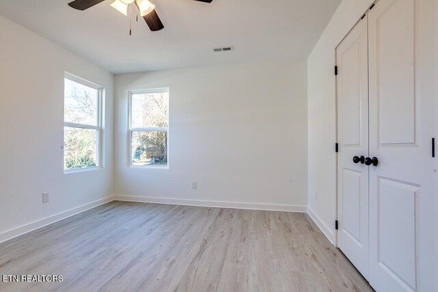 1624 Folsom Ave, Knoxville, TN 37917 - empty room with visible vents, a ceiling fan, baseboards, and light wood-type flooring