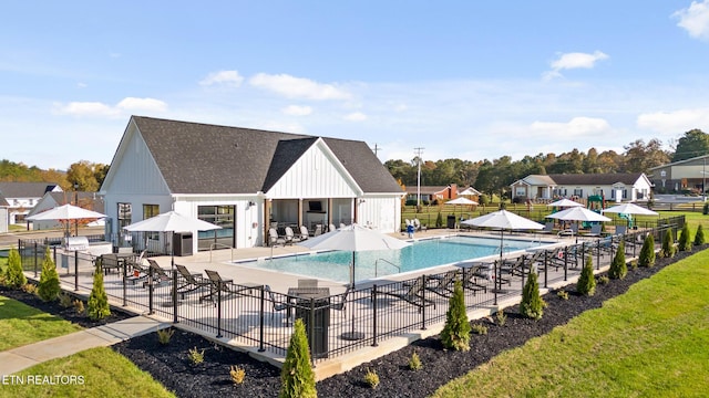 pool featuring a patio and fence