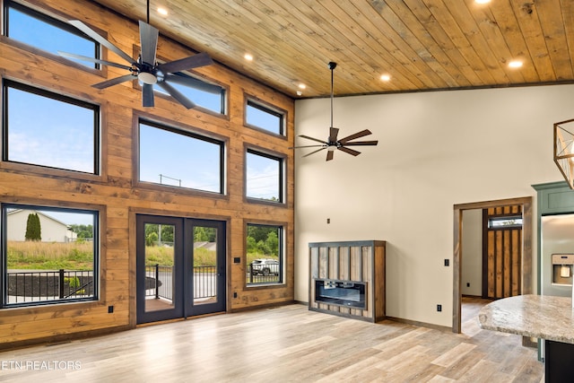 2304 Judson Ln, Sevierville, TN 37876 - unfurnished living room featuring wooden ceiling, a ceiling fan, a high ceiling, recessed lighting, and plenty of natural light