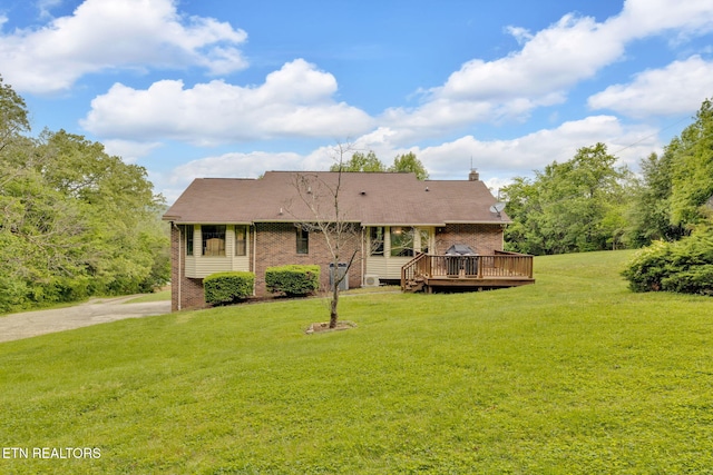 243 Bunch Ln, Clinton, TN 37716 - rear view of house with brick siding, a deck, and a lawn