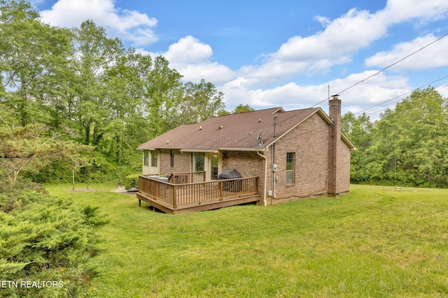 243 Bunch Ln, Clinton, TN 37716 - rear view of house with a chimney, brick siding, a yard, and a wooden deck