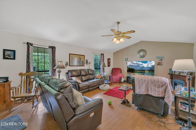 243 Bunch Ln, Clinton, TN 37716 - living area with ceiling fan, wood finished floors, plenty of natural light, vaulted ceiling, and a fireplace