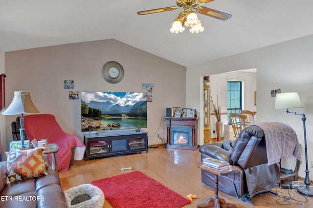 243 Bunch Ln, Clinton, TN 37716 - living area with vaulted ceiling, a ceiling fan, and wood finished floors