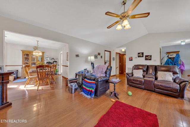 243 Bunch Ln, Clinton, TN 37716 - living room with vaulted ceiling, ceiling fan, wood finished floors, and a chandelier