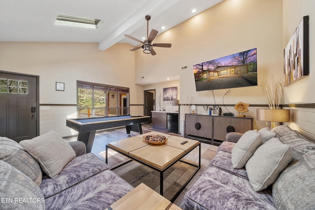 rec room with beamed ceiling, ceiling fan, high vaulted ceiling, a wainscoted wall, and pool table