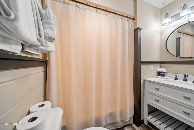 full bath featuring wood finished floors and vanity