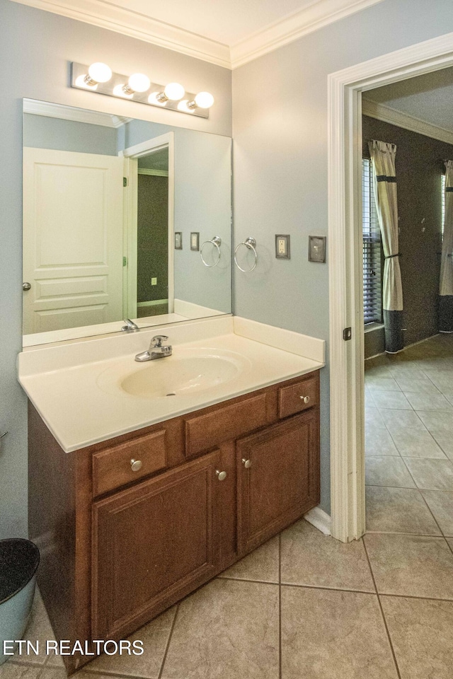 bathroom featuring tile patterned floors, vanity, and ornamental molding