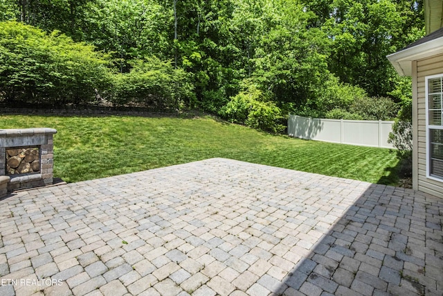 view of patio featuring fence