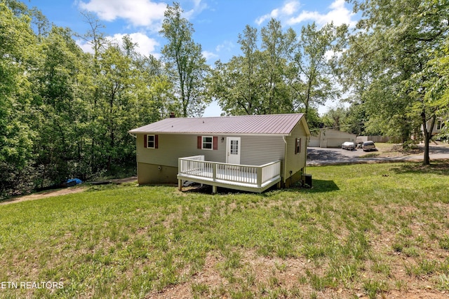 136 White Oak Dr, Harriman, TN 37748 - rear view of property with a lawn, central AC unit, a deck, and metal roof