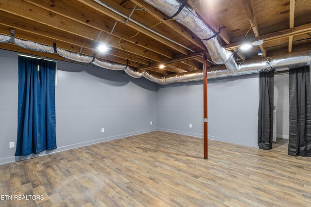 136 White Oak Dr, Harriman, TN 37748 - basement featuring baseboards and wood finished floors