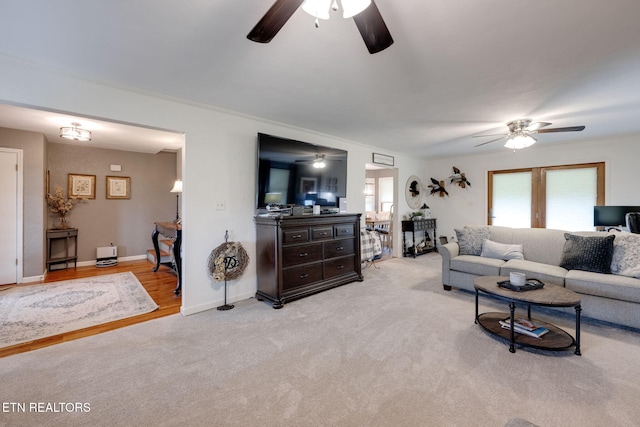 291 County Road 275, Niota, TN 37826 - living room featuring a ceiling fan, healthy amount of natural light, light colored carpet, and baseboards