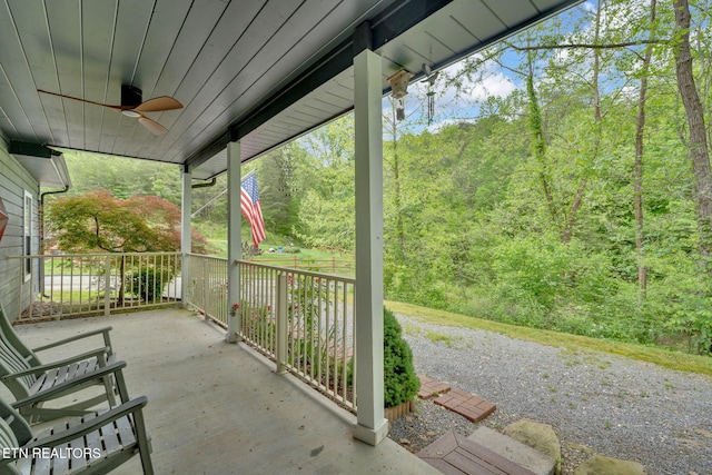 1045 Indian Gap Rd, Sevierville, TN 37876 - view of patio featuring a porch, a view of trees, and a ceiling fan