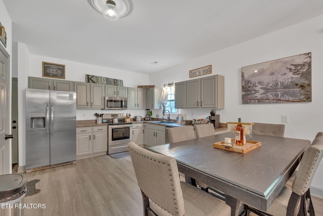 1045 Indian Gap Rd, Sevierville, TN 37876 - dining room featuring light wood-style floors