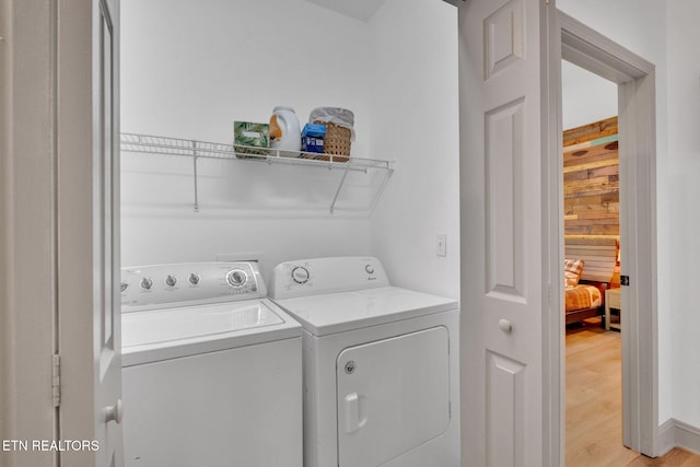 1045 Indian Gap Rd, Sevierville, TN 37876 - laundry room featuring laundry area, light wood finished floors, and washer and dryer
