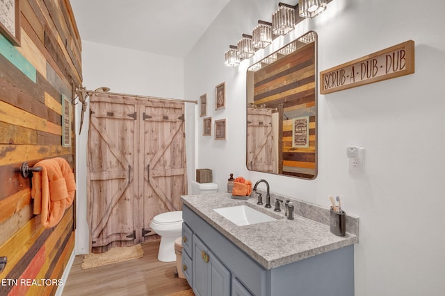 1045 Indian Gap Rd, Sevierville, TN 37876 - bathroom featuring vanity, toilet, a shower with curtain, and wood finished floors