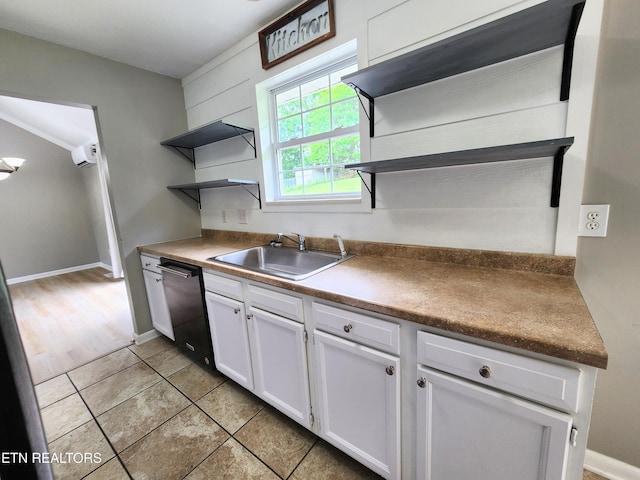 701 Misty Ridge Dr, Lenoir City, TN 37772 - kitchen with open shelves, dishwasher, a sink, white cabinets, and light tile patterned floors