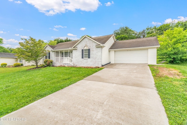 701 Misty Ridge Dr, Lenoir City, TN 37772 - ranch-style home featuring an attached garage, driveway, a porch, and a front yard