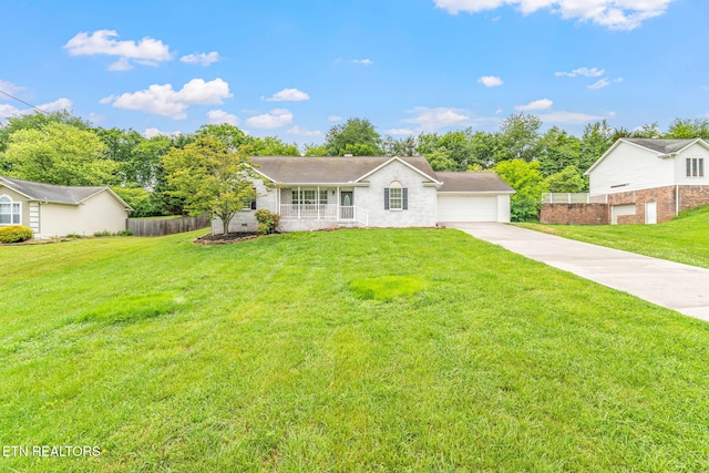 701 Misty Ridge Dr, Lenoir City, TN 37772 - ranch-style home with a porch and concrete driveway