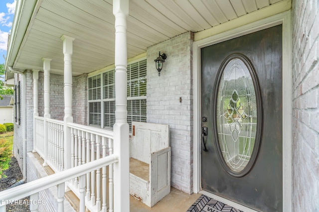 701 Misty Ridge Dr, Lenoir City, TN 37772 - view of exterior entry with brick siding and a porch