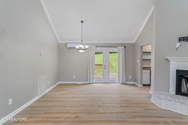 701 Misty Ridge Dr, Lenoir City, TN 37772 - unfurnished living room featuring vaulted ceiling, crown molding, a brick fireplace, a chandelier, and baseboards