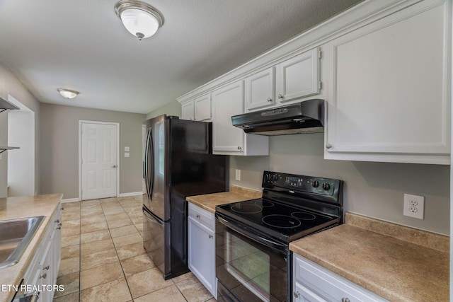 701 Misty Ridge Dr, Lenoir City, TN 37772 - kitchen featuring under cabinet range hood, black / electric stove, freestanding refrigerator, white cabinetry, and light countertops