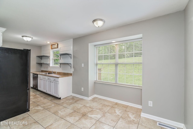 701 Misty Ridge Dr, Lenoir City, TN 37772 - kitchen featuring stainless steel appliances, open shelves, a sink, white cabinetry, and healthy amount of natural light