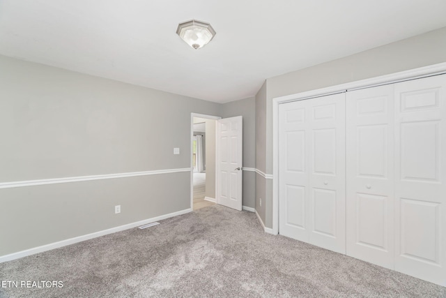 701 Misty Ridge Dr, Lenoir City, TN 37772 - unfurnished bedroom featuring carpet flooring, baseboards, and a closet