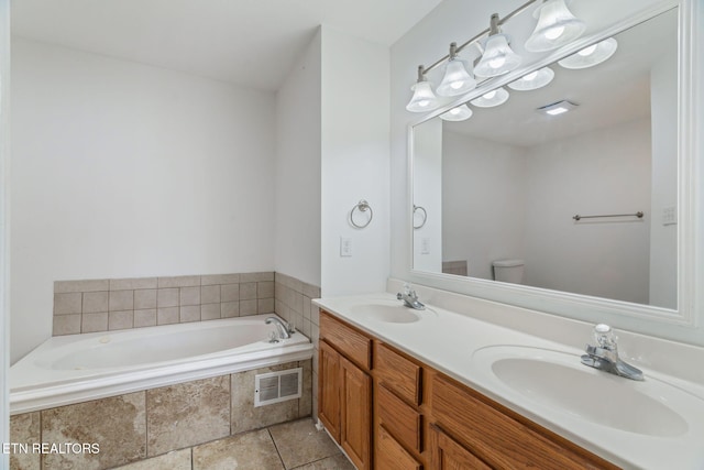 701 Misty Ridge Dr, Lenoir City, TN 37772 - full bathroom featuring a garden tub, double vanity, toilet, and tile patterned flooring