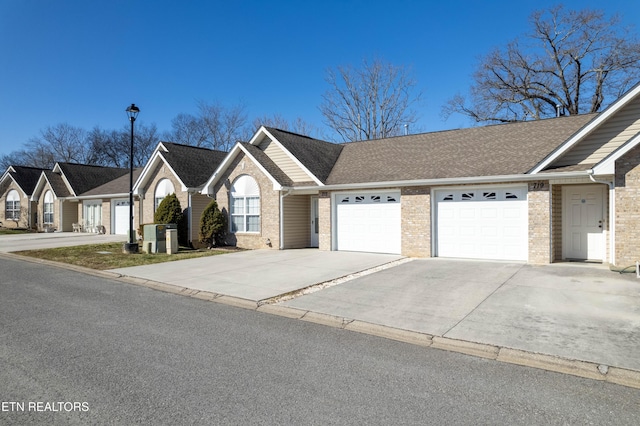 view of front of home featuring concrete driveway, brick siding, an attached garage, and a shingled roof