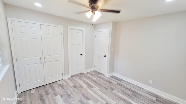 unfurnished bedroom with recessed lighting and light wood-style flooring