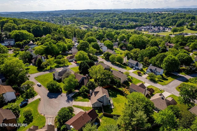 bird's eye view featuring a residential view and a forest view