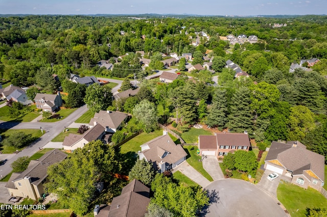 bird's eye view featuring a residential view and a view of trees