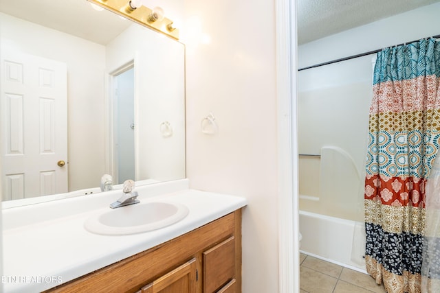 bathroom with shower / tub combo with curtain, tile patterned flooring, and vanity
