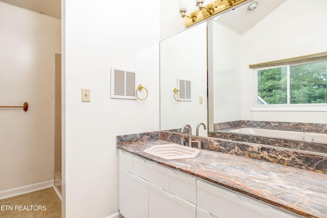 bathroom featuring baseboards, tile patterned flooring, vanity, and visible vents