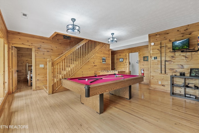 playroom with wooden walls, billiards, light wood finished floors, and visible vents