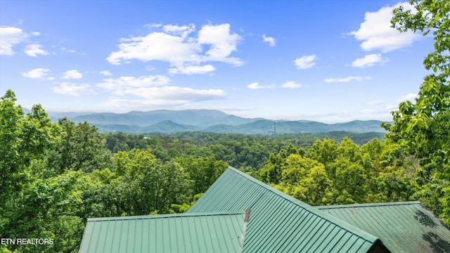 mountain view with a wooded view