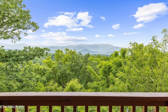 mountain view featuring a forest view