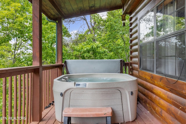 deck with a hot tub