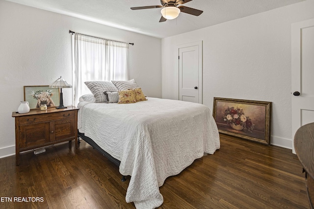 bedroom featuring baseboards, a ceiling fan, and wood finished floors