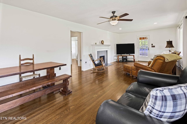 living area featuring recessed lighting, a brick fireplace, a ceiling fan, and wood finished floors