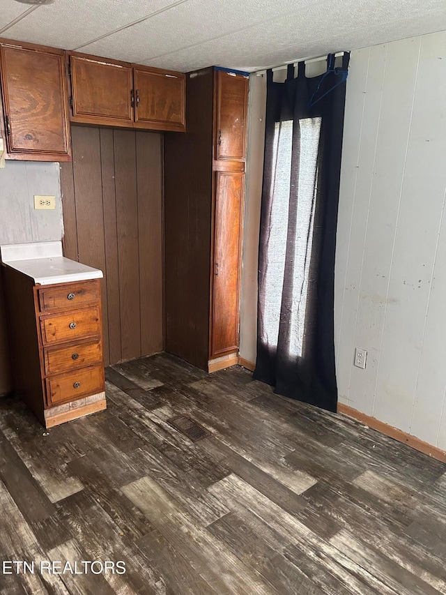 464 Brushy Valley Rd, Clinton, TN 37716 - unfurnished dining area featuring dark wood-type flooring and baseboards