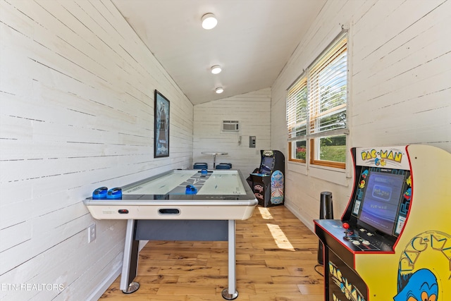 2738 Indian Creek Rd, Dandridge, TN 37725 - recreation room with wood walls, vaulted ceiling, wood finished floors, and a wall mounted air conditioner