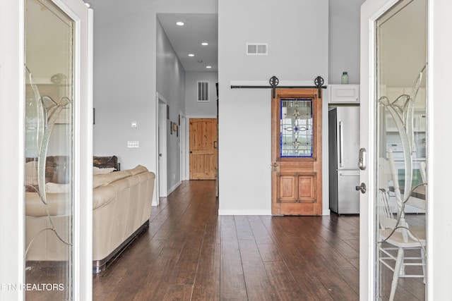 2738 Indian Creek Rd, Dandridge, TN 37725 - foyer featuring visible vents, dark wood finished floors, a towering ceiling, and baseboards