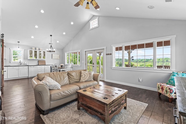 2738 Indian Creek Rd, Dandridge, TN 37725 - living room featuring high vaulted ceiling, recessed lighting, french doors, dark wood finished floors, and ceiling fan with notable chandelier