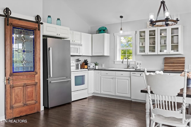 2738 Indian Creek Rd, Dandridge, TN 37725 - kitchen with a notable chandelier, lofted ceiling, glass insert cabinets, white appliances, and white cabinetry
